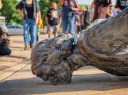 "The fallen Christopher Columbus statue outside the Minnesota State Capitol after a group led by American Indian Movement members tore it down in St. Paul, Minnesota, on June 10, 2020." 