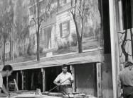 Men work on move backdrop, black and white image