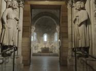 interior met cloisters, view down hall with sculptures 