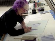 Judy Chicago in her studio working on paper