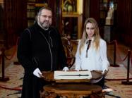 Father Serafino Jamourlian and Vittoria Dall'Armellina with the sword