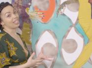 Emma Dabiri talks in front of painting