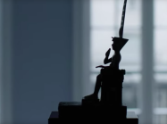 Silhouette of seated Egyptian bronze   
