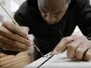 Marlon Mullen at work on painting