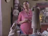Artist works on sculpture in her studio