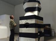 Portrait of Mel Kendrick with his artwork