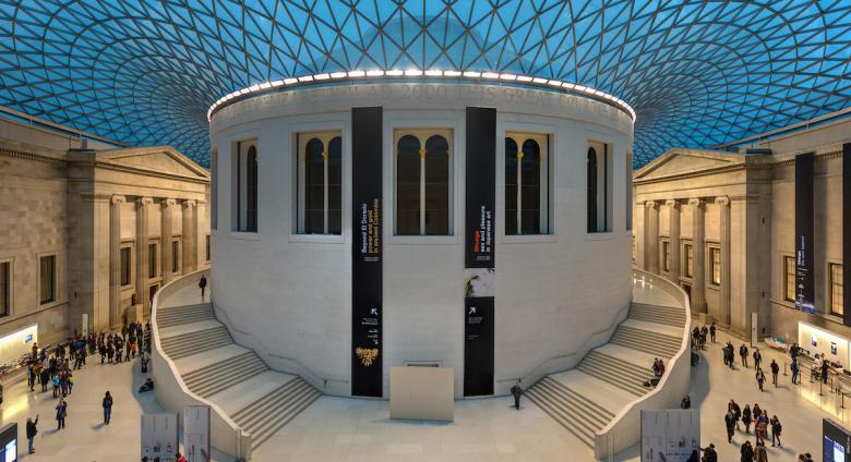An ultra-wide rectilinear stitched panorama of the Great Court of the British Museum in London, United Kingdom.