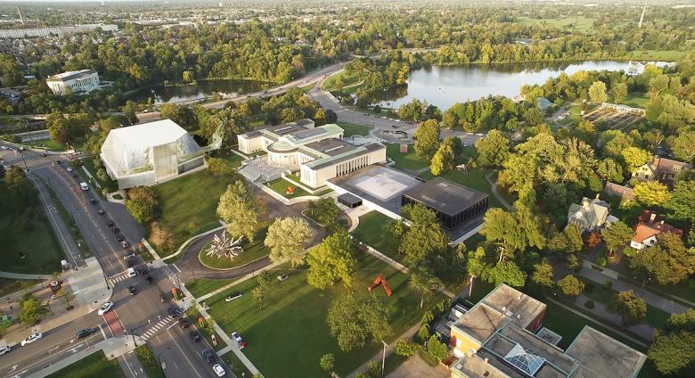 Aerial view of the museum's campus, including a rendering of the new Gundlach Building, Great Lawn, and indoor Town Square covered by Olafur Eliasson and Sebastian Behmann's Common Sky.