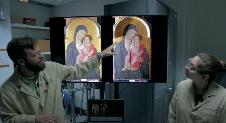 two scientists look at two paintings on computer screen