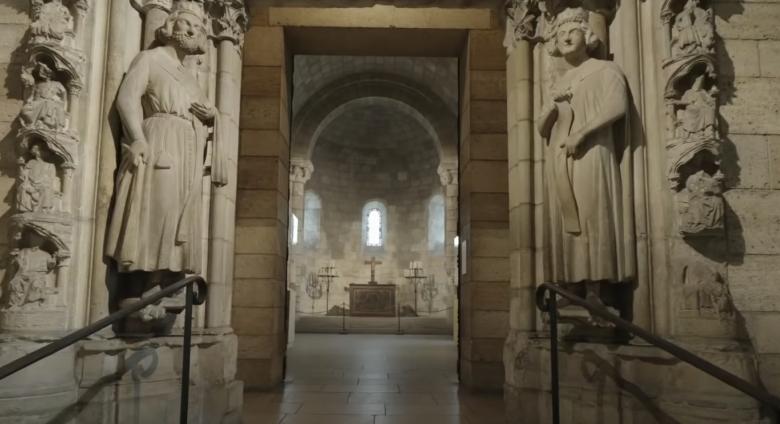 interior met cloisters, view down hall with sculptures 