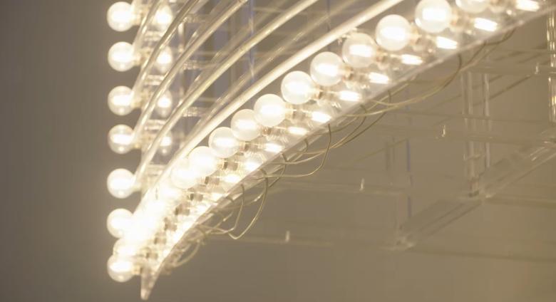 installation art piece composed of rows of lightbulbs that alternately light up.