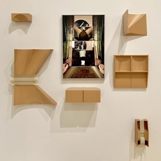 B. Ingrid Olson, Coming in with your back turned, 2021-22. Inkjet print and UV printed matboard in powder-coated aluminum frame, 29 x 19.25 x 1.25 in. (73.7 x 48.8 x 3.2 cm) and Proto Coda, Index (detail), 2016-22.