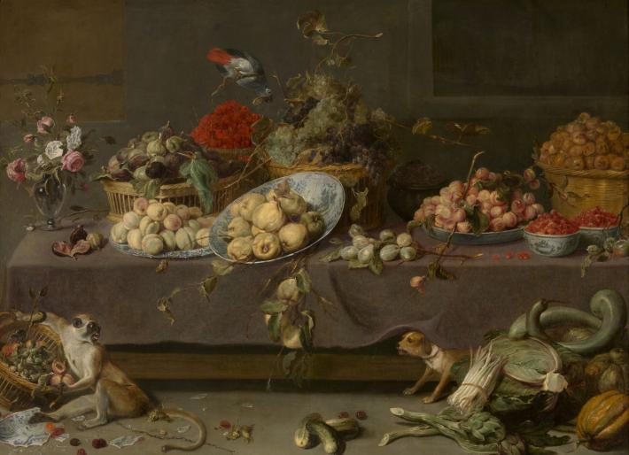 Frans Snyders elaborate still life of a table overflowing with fruits and flowers, with a monkey and puppy on the floor scavenging