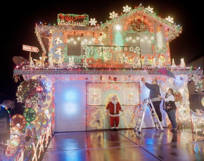 A home with bright christmas lights in the rain